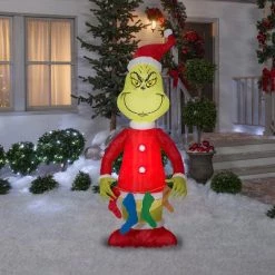The Grinch Grinch Christmas Airblown Inflatable Holding String of Stockings, 6.5 ft Tall, Red